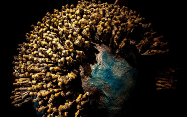 planet-earth-and-people-on-black-background-600x375